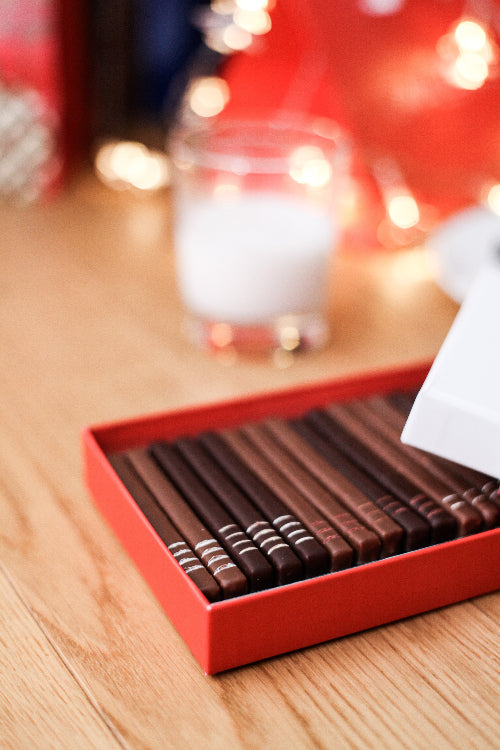 Coffret cavaletti dans une ambiance Noel. Chocolat en barres pralinées. Idéale en cadeau d'affaires